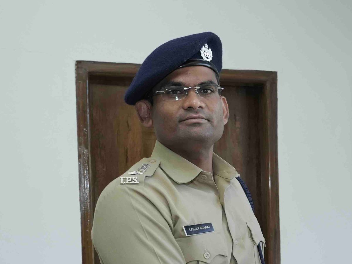 Sanjay Kharat in Indian Police Service uniform wearing a beret, with the I.P.S. shoulder title and a name plate reading Sanjay Kharat.